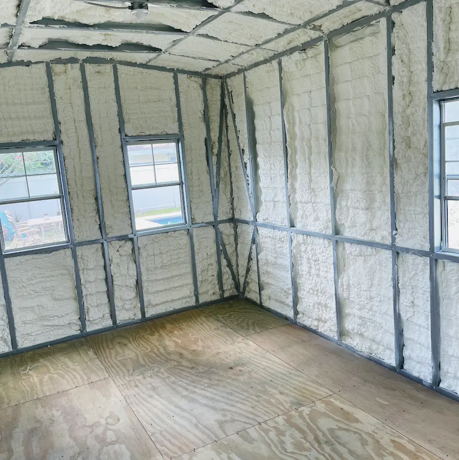 Closed-cell spray foam insulation applied to wall cavities in a residential project in Duncanville